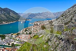 Kotor, Montenegro, Europe. Bay of Kotor on Adriatic Sea. Rock, historical walls, roofs of the buildings in the old town
