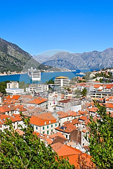 Kotor, Montenegro, Europe. Bay of Kotor on Adriatic Sea. Roofs of the historical buildings in the old town, sea and