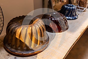 Kougelhopf dishes on a shelf in Alsace,