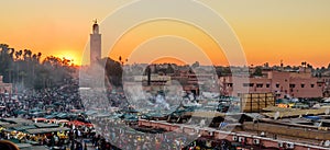 Koutoubia Mosque and Jemaa el-Fnaa market square at sunset