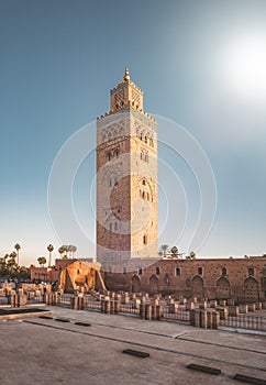 Koutoubia Mosque Minaret in Morocco Marrakesh and gardens during sunset with blue sky. Inside Medina. UNESCO World