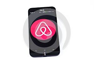 Kouvola, Finland - 23 January 2020: Airbnb app logo on the screen of smartphone Asus