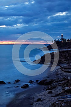 Kovalam Vizhinjam lighthouse on sunset. Kerala, India photo