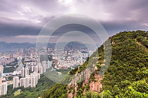 Kowloon city view from Lion Rock hill against cloudy sky during daytime in Hong Kong, China