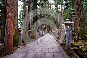 Koyasan, Japan - November 20, 2019: Walkway to Kobodaishi Gobyo Mausoleum at Okunoin Cemetery Park in Mount Koya