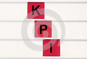 KPI acronym Key Performance Indicator word text inscription on paper sticker