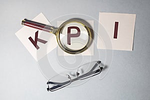 KPI acronym Key Performance Indicator word text inscription on paper sticker