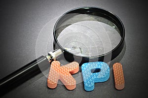 KPI (Key Performance Indicator )words with magnifying glass