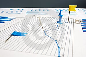 KPI key performance indicators. Thumb tacks and business papers photo