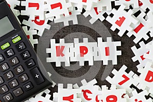 KPI, Key Point Indicator concept, white puzzle jigsaw alphabet c