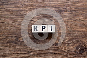 Kpi - word concept on building blocks, text