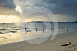 People relax and walking at Ao Nang beach before the sunset