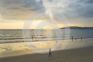 People relax and walking at Ao Nang beach before the sunset