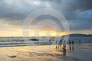 People relax and walking at Ao Nang beach before the sunset
