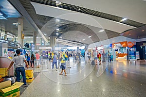 KRABI, THAILAND - FEBRUARY 19, 2018: Indoor view of unidentified people walking inside of the airport of the Krabi