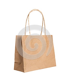 Kraft paper bag with handles, angle view. Brown pack, package isolated on white background