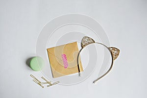 Kraft paper envelope, washi tape, lip balm, golden hair pins and cat ear hair band