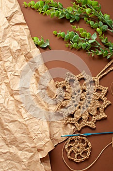 Kraft paper, jute washcloth, knitting. Concept zero waste. vertical photo, DYI