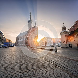 Krakow old town, Market square with St. Mary`s church at sunrise, historical center cityscape, Poland, Europe