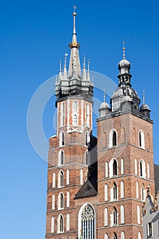 Old city center view with Adam Mickiewicz monument and St. Mary`s Basilica in Krakow