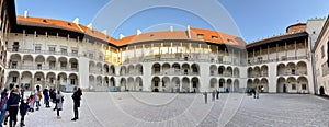 Krakow, Poland. Wawel Castle, Panorama of central courtyard with blue sky above.
