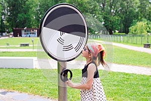 KRAKOW, POLAND - JUNE 17: Museum of Science in the open air. Park. The girl is studying physical laws, optical illusions. STEM