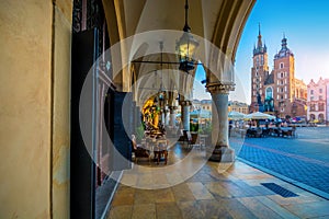 Krakow, Poland - main market square. View on Mariacki Church on a backdrop. Krakow  it is a most beautiful town in Poland, named