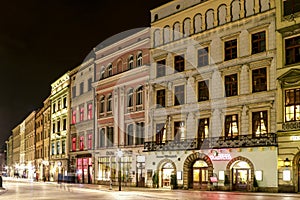 KRAKOW, POLAND - MARCH 19, 2016: City center by night: ancient temements. Grodzka Street