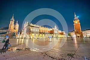 KRAKOW, POLAND - OCTOBER 1, 2017: Tourists visit the main square at night