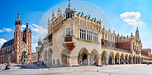 Krakow, Poland - 08/08/2020 - St. Mary`s Church and cloth hall in the Market Square in Krakow