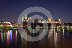 Krakow, Poland, Wawel Castle and Wawel cathedral over Vistula river in the night