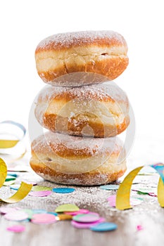 Krapfen, Berliner or donuts with streamers and confetti