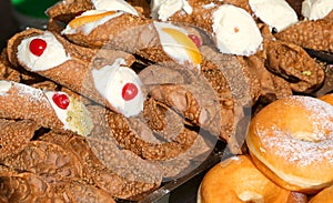 Krapfen and Italian dessert typical of Sicily Region in Italy called CANNOLO SICILIANO