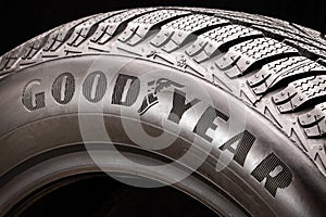 Krasnoyarsk, Russia, September 2019: Goodyear logo on the sidewall of a black tire close-up. world tire company