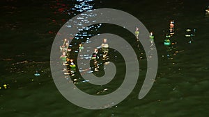 Krathong is floating in river at Loykrathong day night time Festival thailnad 4k 25fps.