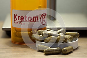 Kratom pills on a desk