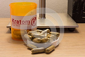 Kratom pills on a desk