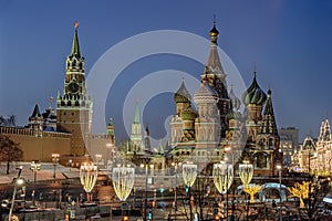 Kremlin Clock Tower and St. Basilâ€™s Cathedral Framed by Festive Street Lights in Twilight