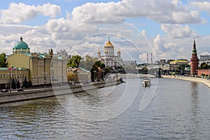 Kremlin embankment at the Moscow center with the kremlin wall, Moskva river and the Cathedral of Christ the Saviour, Russian Feder