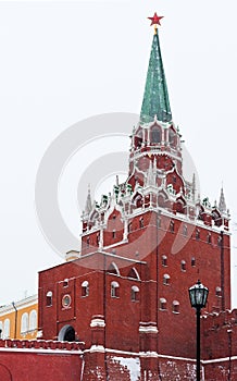 Kremlin Troitskaya Tower in winter snowing day