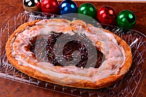 Kringle at Christmas Time with colorful Ornaments