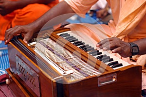 Krishna Devotee Playing Harmonium photo