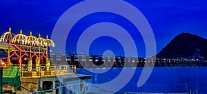 Krishna river Arati against the backdrop ofPrakasam Barrage in the night, Vijayawada, Andhrapradesh, India