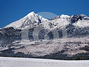 Krivan, Kratka and Ostra Peaks in winter photo