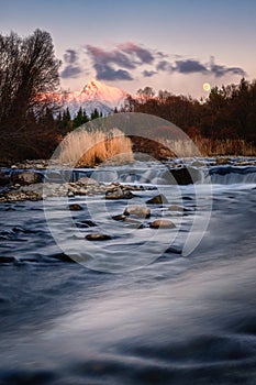 Krivan mountain and Bela river at sunset with Moon