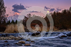 Krivan mountain and Bela river at sunset with Moon