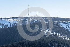 Krizava and Velka luka hills with communication towers in winter Mala Fatra mountains in Slovakia