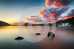 Krk bridge at dusk with colorful sunset, Croatia