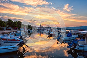 Krk, the largest town on the Krk island, Kvarner bay, Croatia. Scenic view of the harbor, embankment and Krk cathedral at sunrise