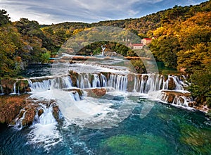 Krka, Croatia - Aerial view of the famous Krka Waterfalls in Krka National Park on a bright autumn morning with autumn foliage